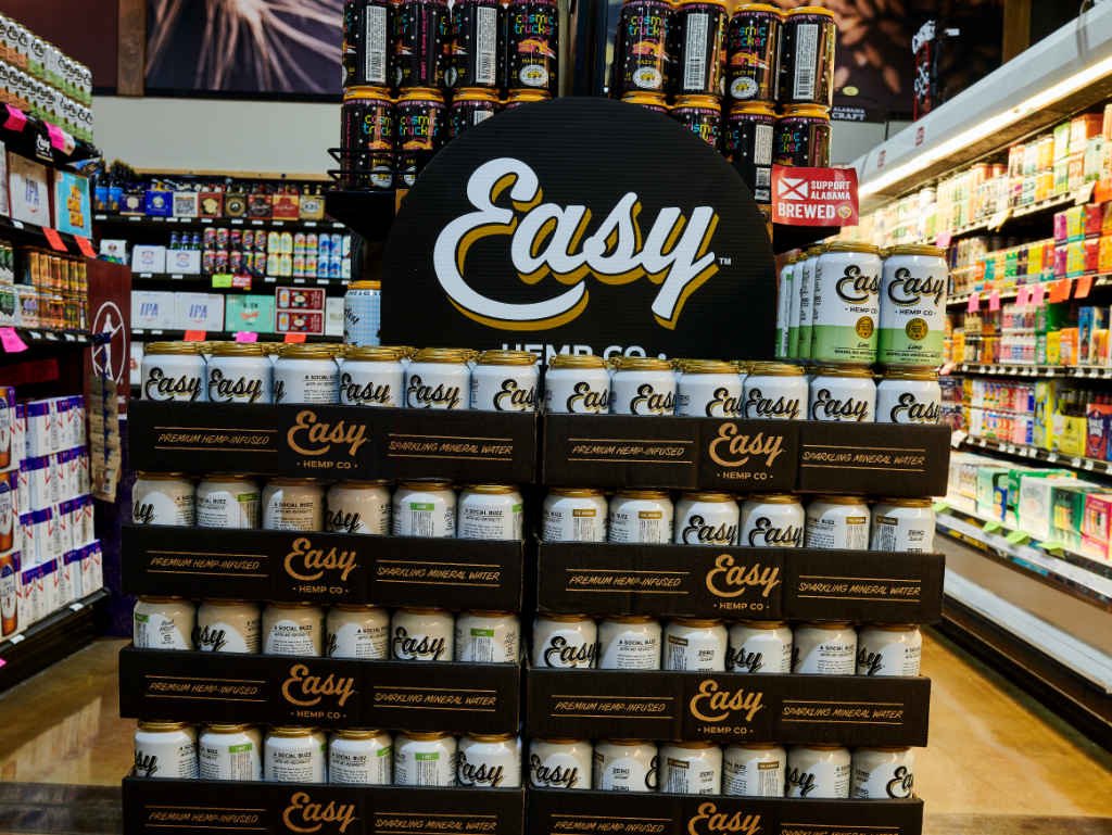 A neatly stacked display of Easy Hemp infused sparkling water at Piggly Wiggly in Birmingham, Alabama, featuring various flavors of the local premium hemp-infused beverage.