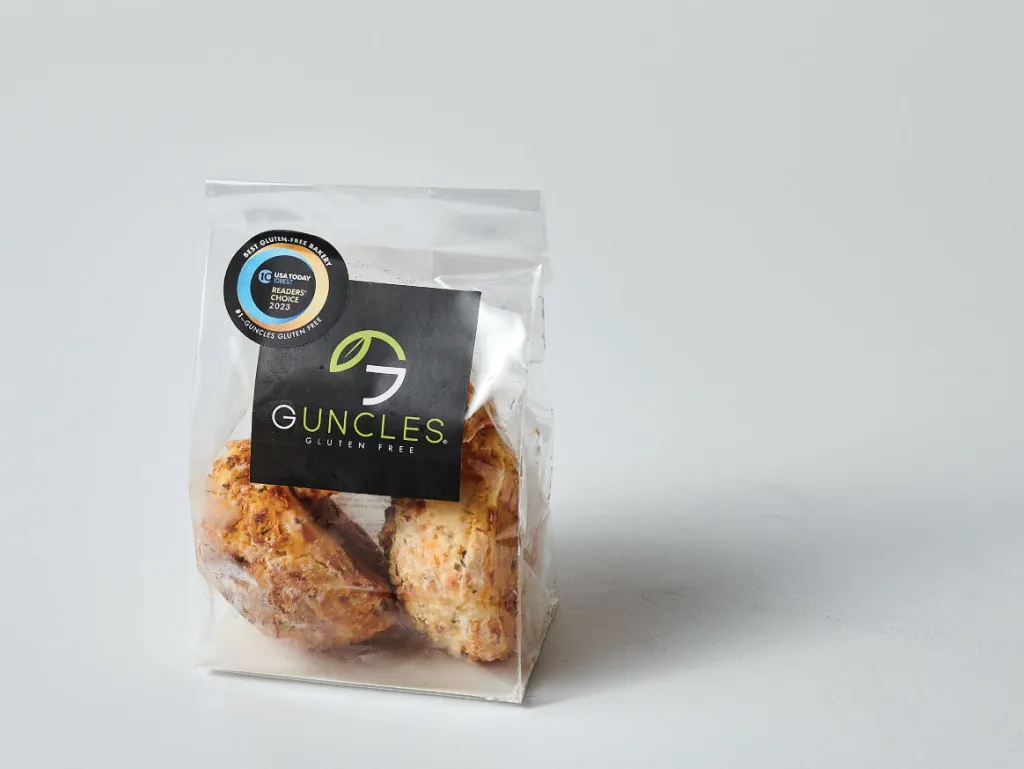 A packaged set of Guncles gluten-free coconut macaroons, displayed in a clear plastic bag with a branded label.