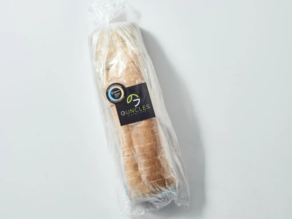 A loaf of Guncles gluten-free sliced bread, packaged in a clear plastic bag with a branded label.
