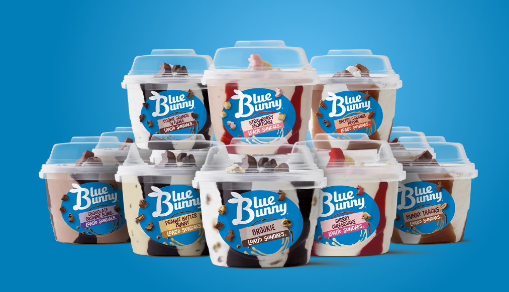 Assorted Blue Bunny Load'd Sundaes ice cream cups stacked against a blue background
