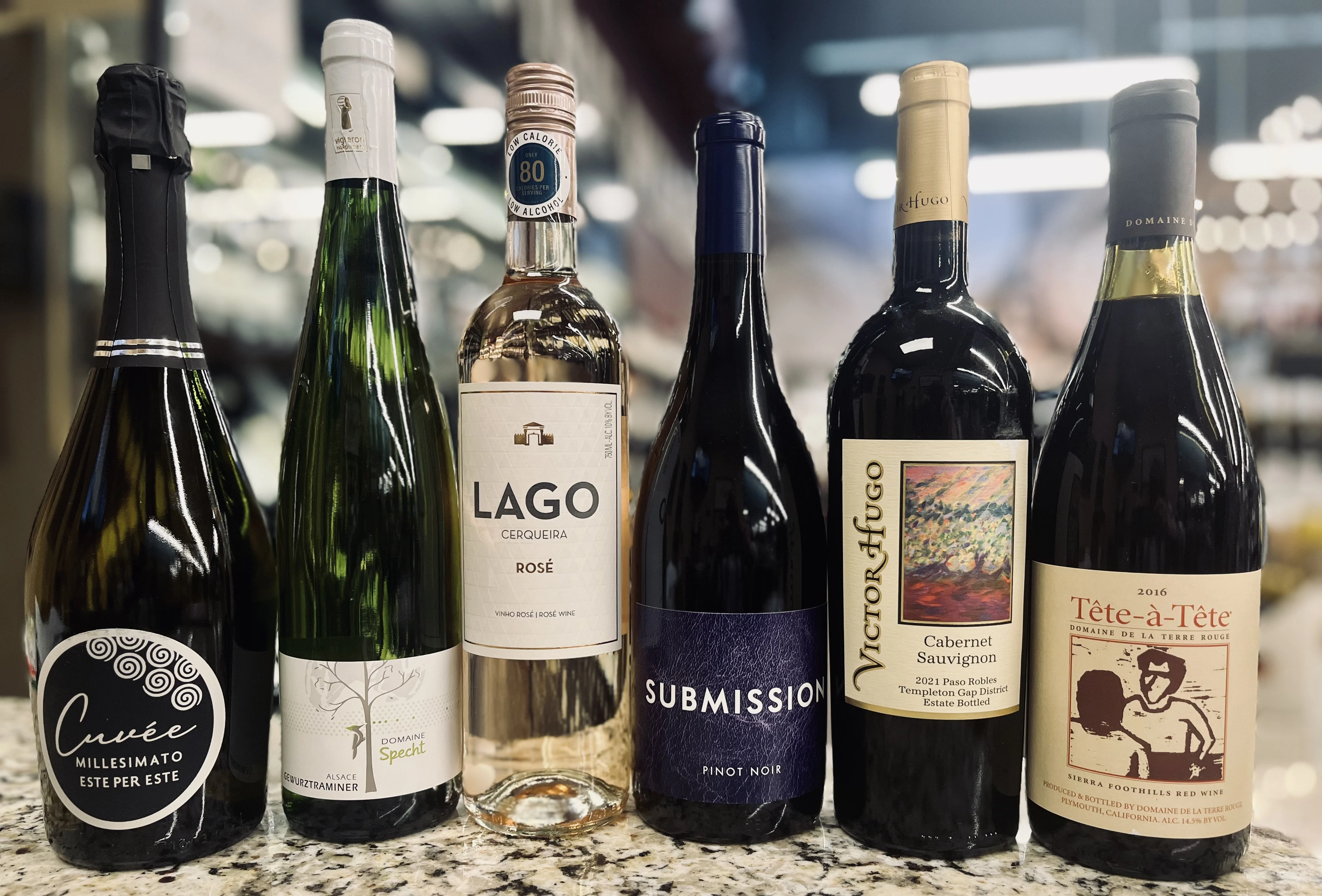 Assorted wine bottles including rosé, pinot noir, cabernet sauvignon and sparkling wine displayed for a May wine tasting event at Pig Dunnavant Valley with Rush Wines