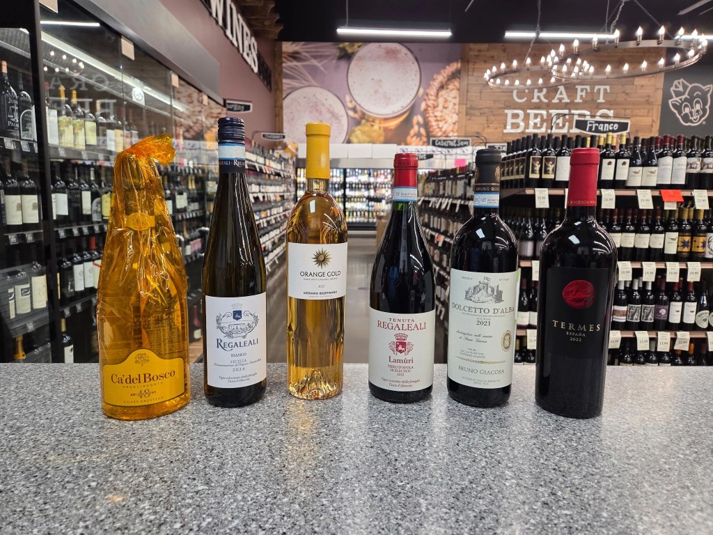 Display of sparkling, white, orange, and red wines featured for a June summer wine tasting event at a Piggly Wiggly store in Birmingham, Alabama.