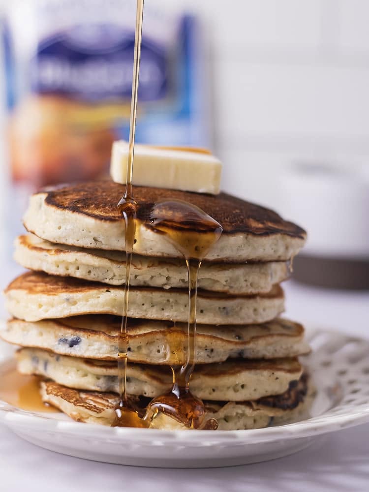 Stack of warm pancakes topped with butter and maple syrup representing the Martha White Muffin Mix Deal of the Week